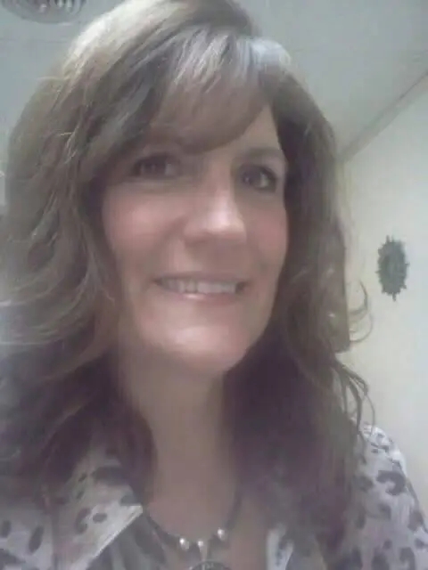 Penny, licensed cosmetologist at Vintage Barbershop and Salon