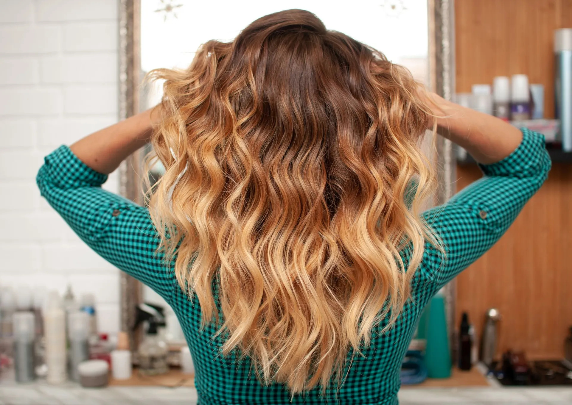 Client with freshly colored, glossy highlighted hair