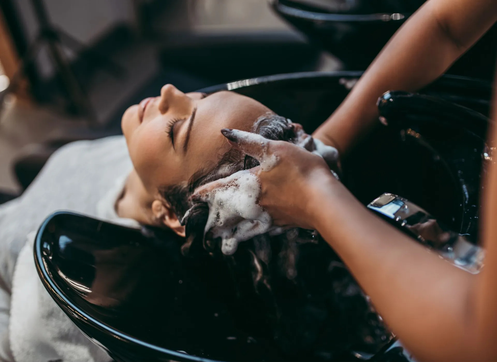 Stylist at work inside Vintage Barbershop and Salon